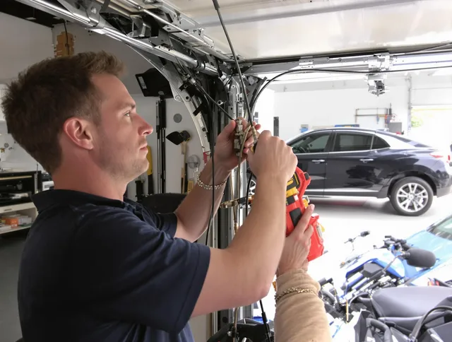 Alhambra Garage Door Repair safety certified technician performing cable replacement in Alhambra